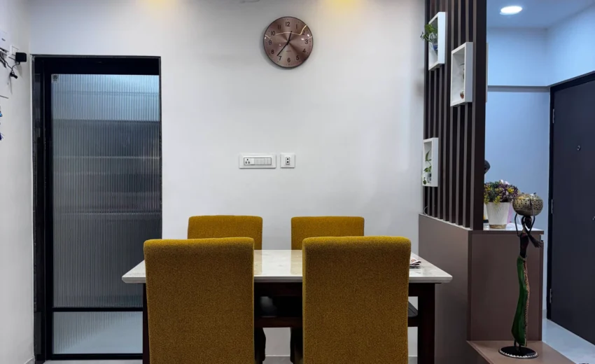 Compact dining setup in affordable 2BHK interior design by KitchenLane at Blue Empire Complex, Kandivali